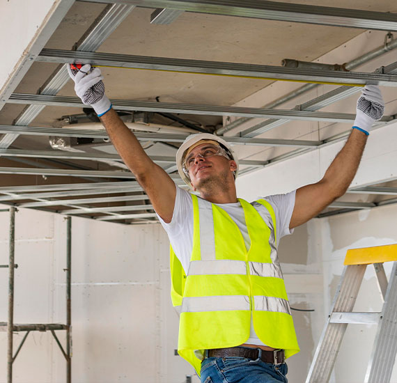 Man working wearing protection gear